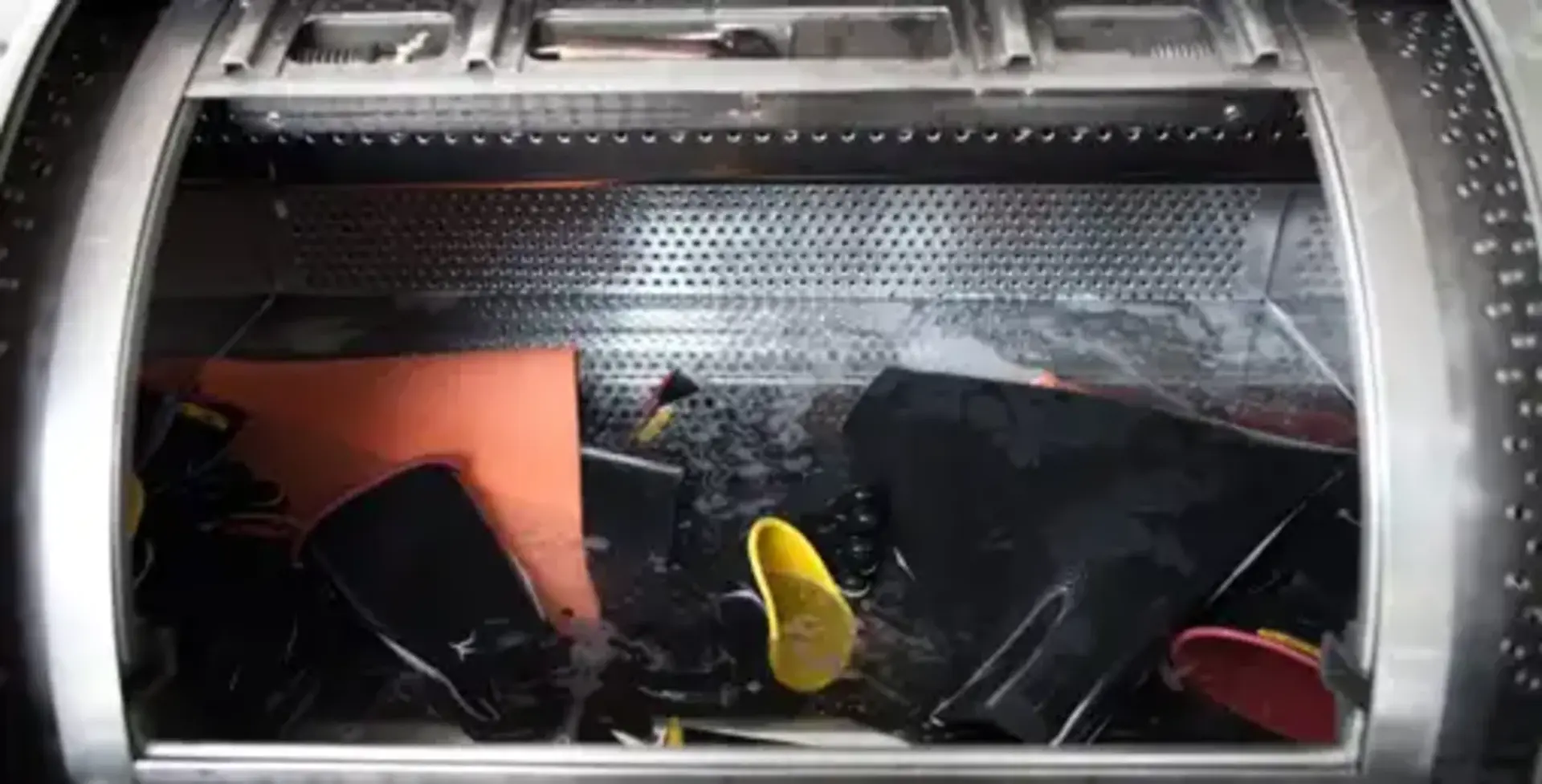 Rubber gloves being washed in commercial washers with specialized detergents